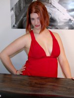 Full redhead honey takes her little red dress off